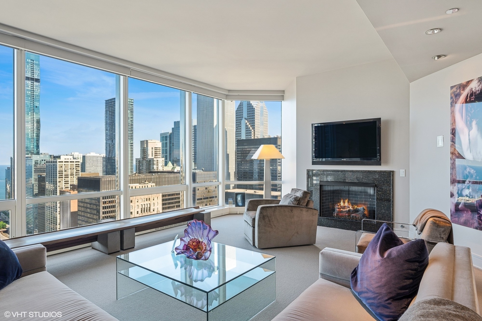 401 North Wabash Avenue, Unit 33K Chicago, IL 60611 - Photo 4 of 45 a living room with furniture flat screen tv and a fireplace