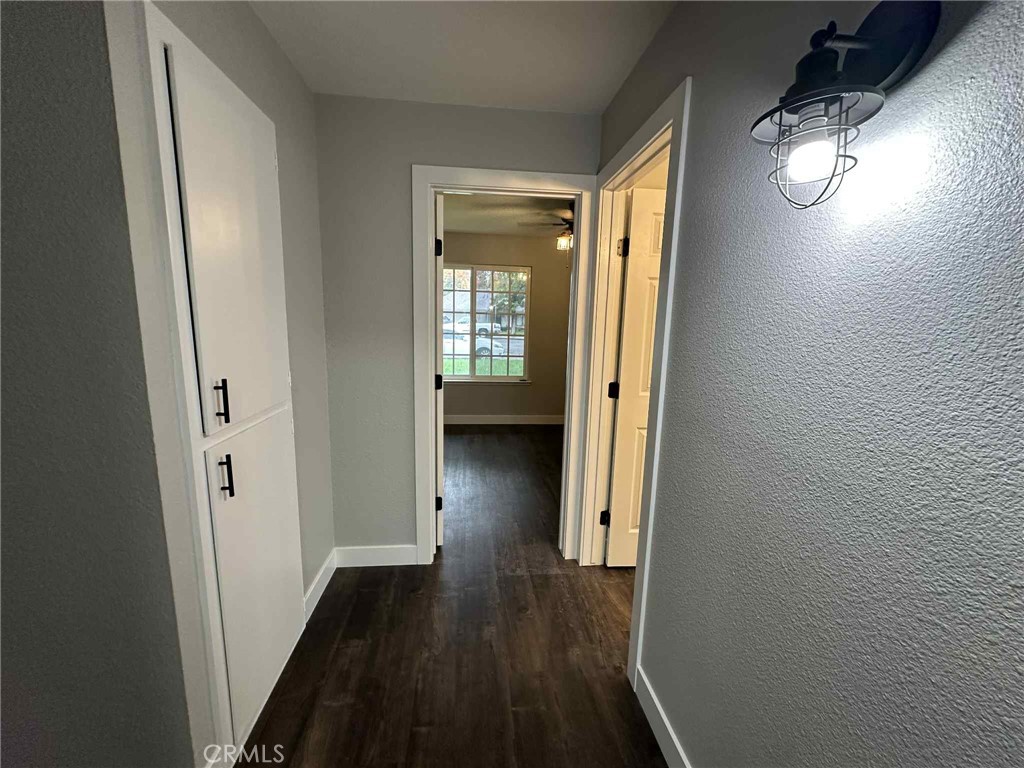 1939 Sierra Court Merced, CA 95340 - Photo 12 of 22 a view of a hallway and wooden floor