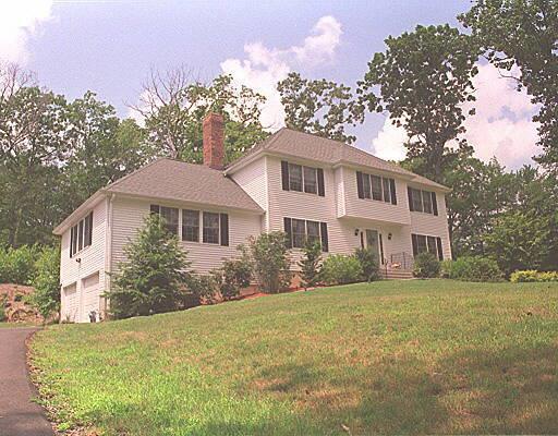12 Fawnwood Road Newtown, CT 06482 - Photo 1 of 1 a front view of a house with a garden