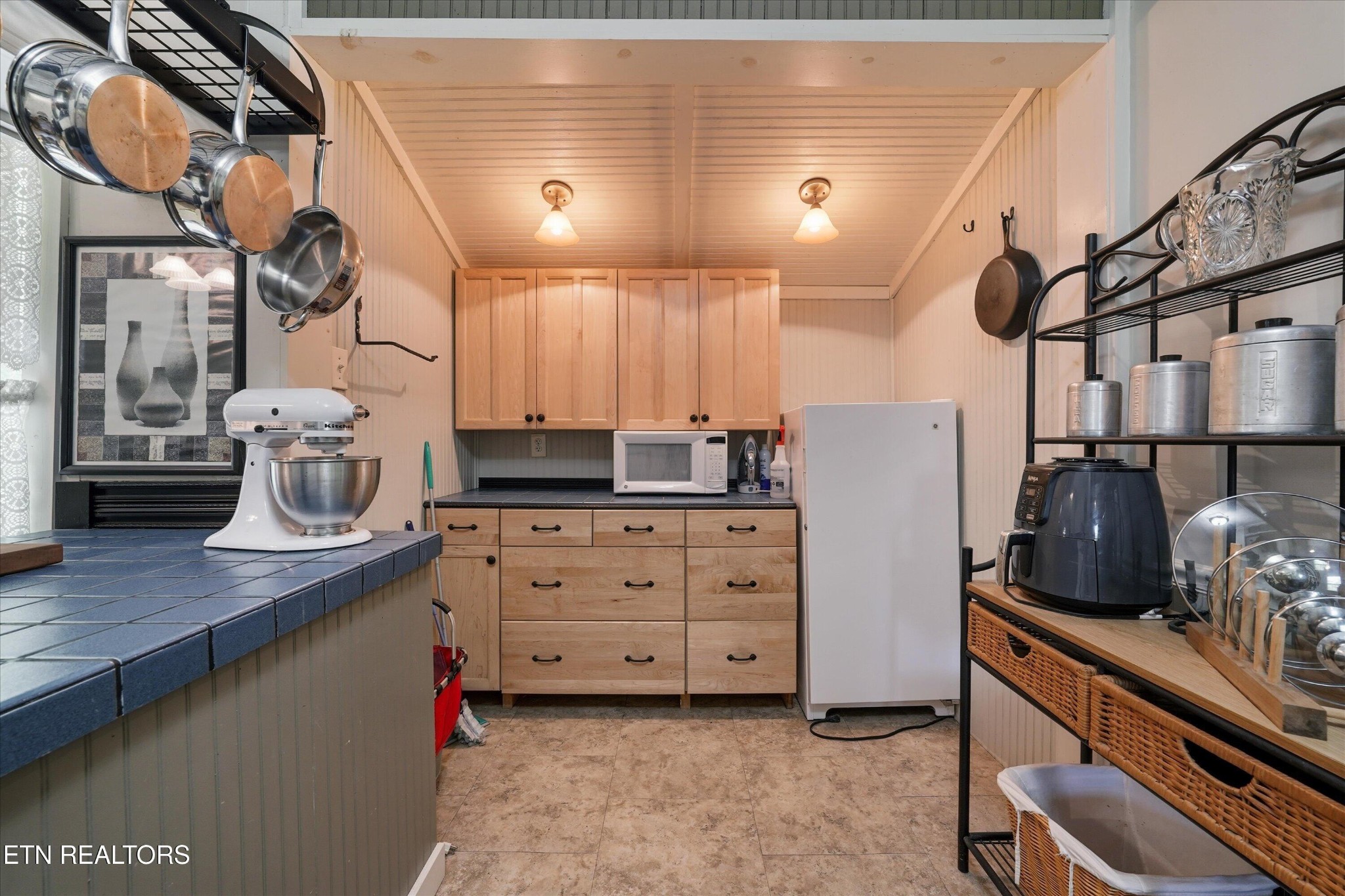 315 Laurel Hollow Road Clinton, TN 37716 - Photo 13 of 40 a kitchen with cabinets and chairs