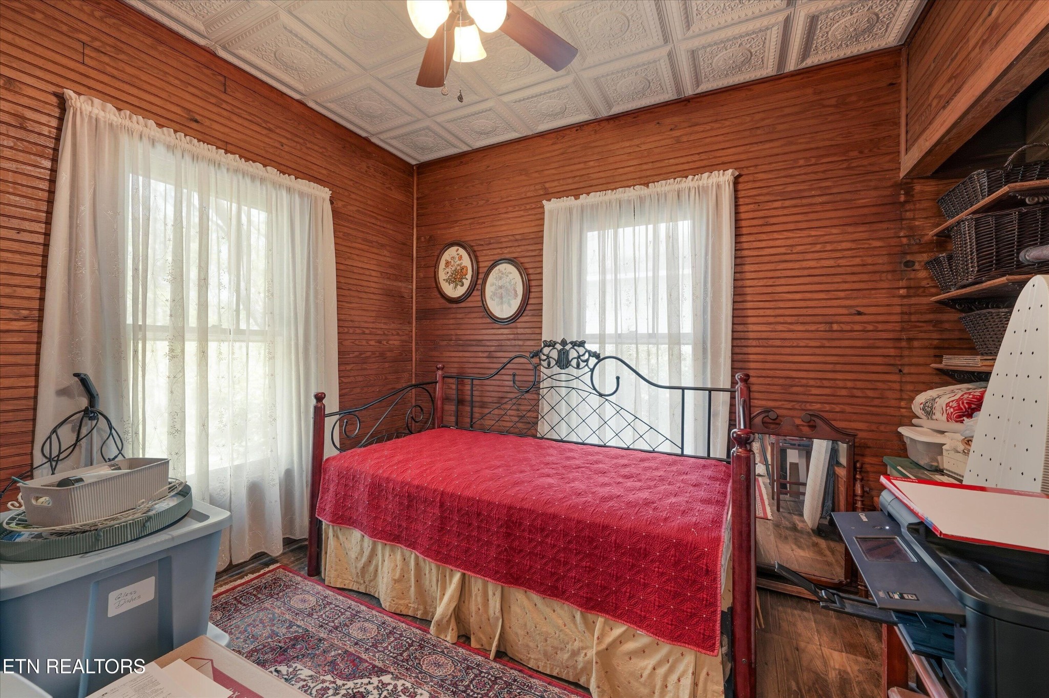 315 Laurel Hollow Road Clinton, TN 37716 - Photo 17 of 40 a bedroom with a bed and a chandelier