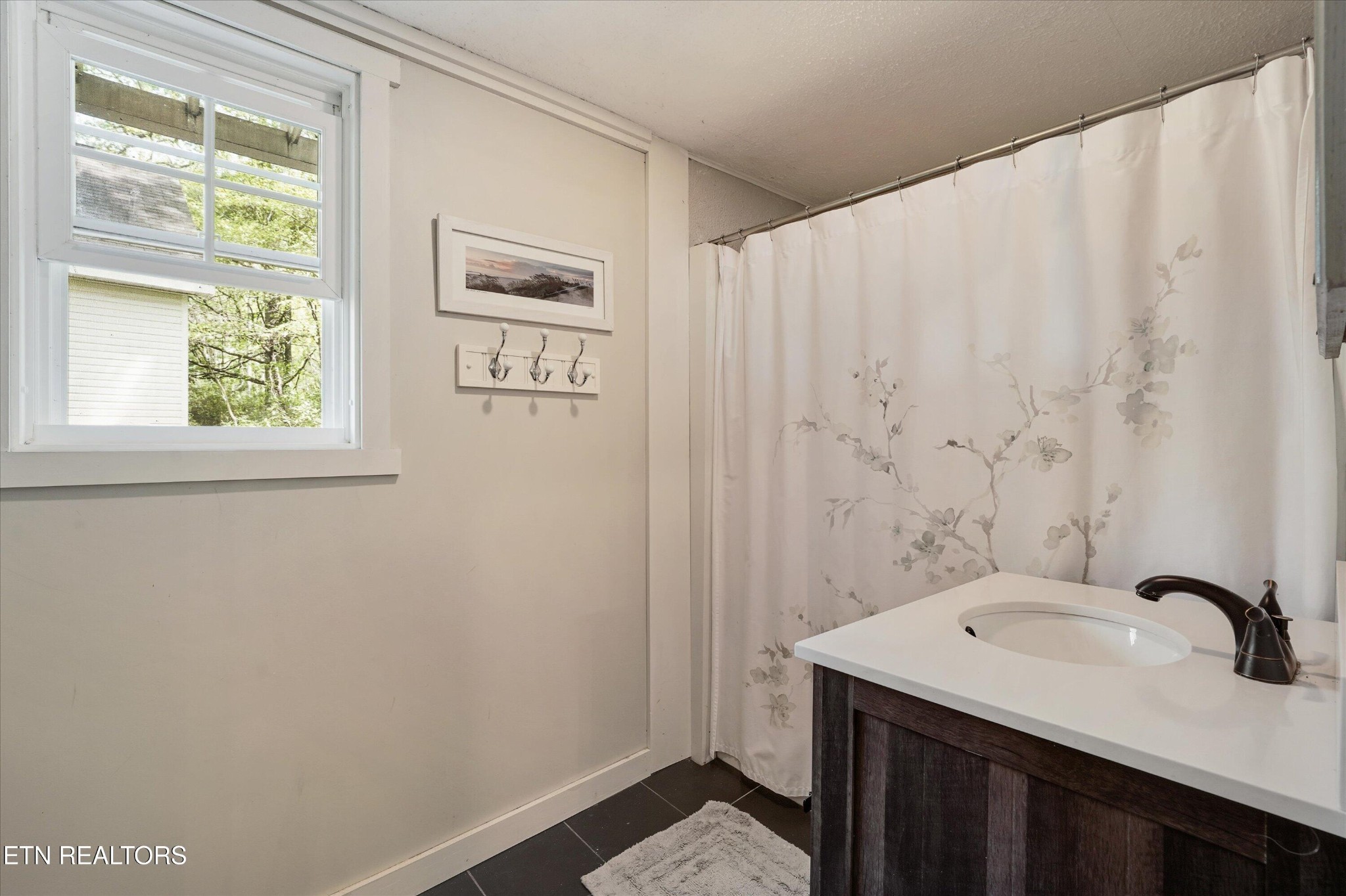 315 Laurel Hollow Road Clinton, TN 37716 - Photo 22 of 40 a bathroom with a sink and a mirror