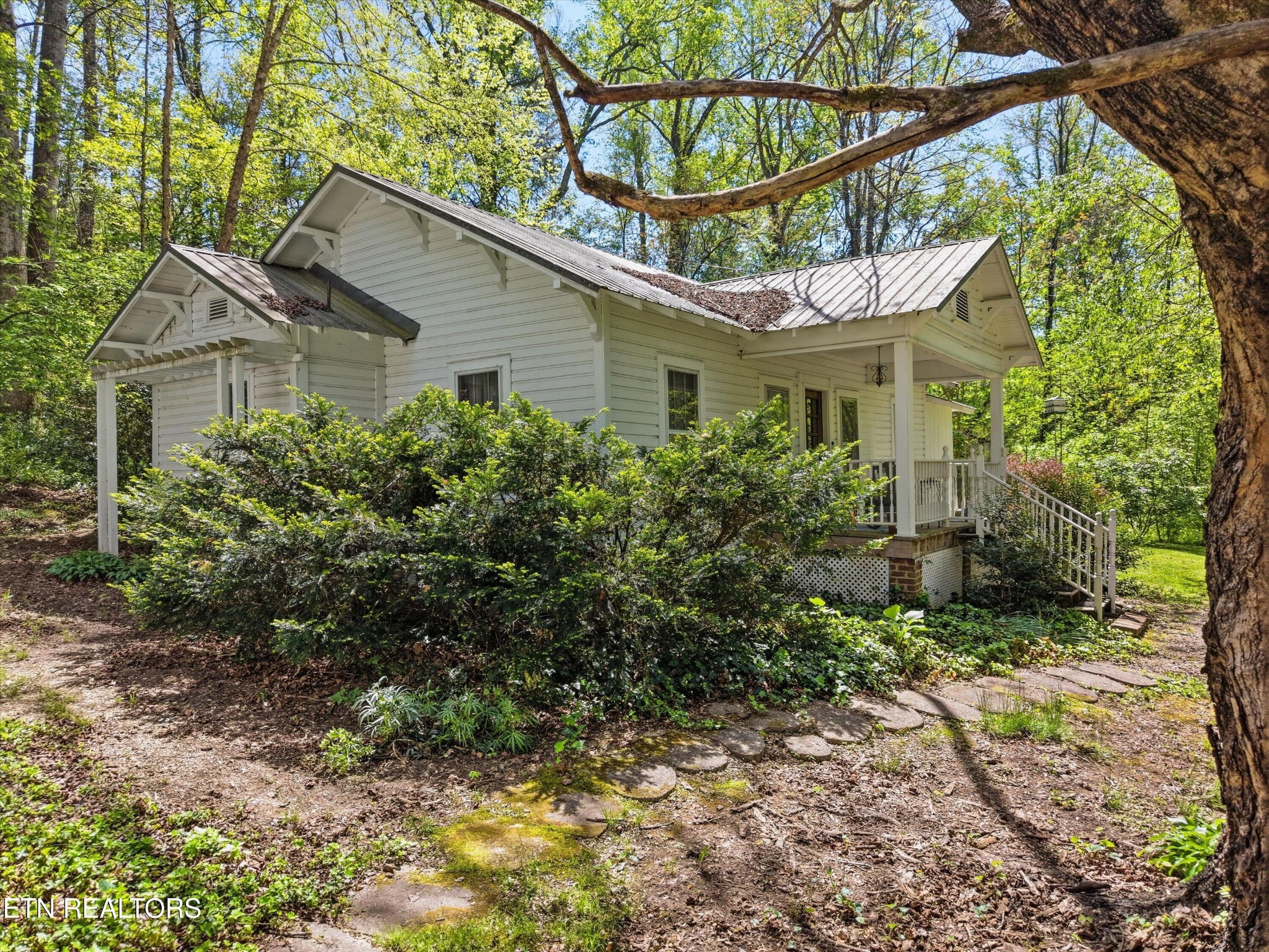 315 Laurel Hollow Road Clinton, TN 37716 - Photo 26 of 40 a view of a house with a yard and potted plants