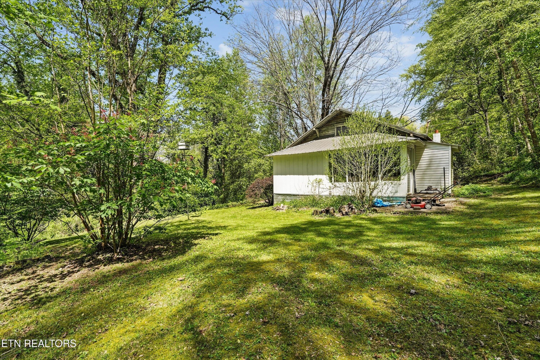 315 Laurel Hollow Road Clinton, TN 37716 - Photo 30 of 40 a view of a house with a yard