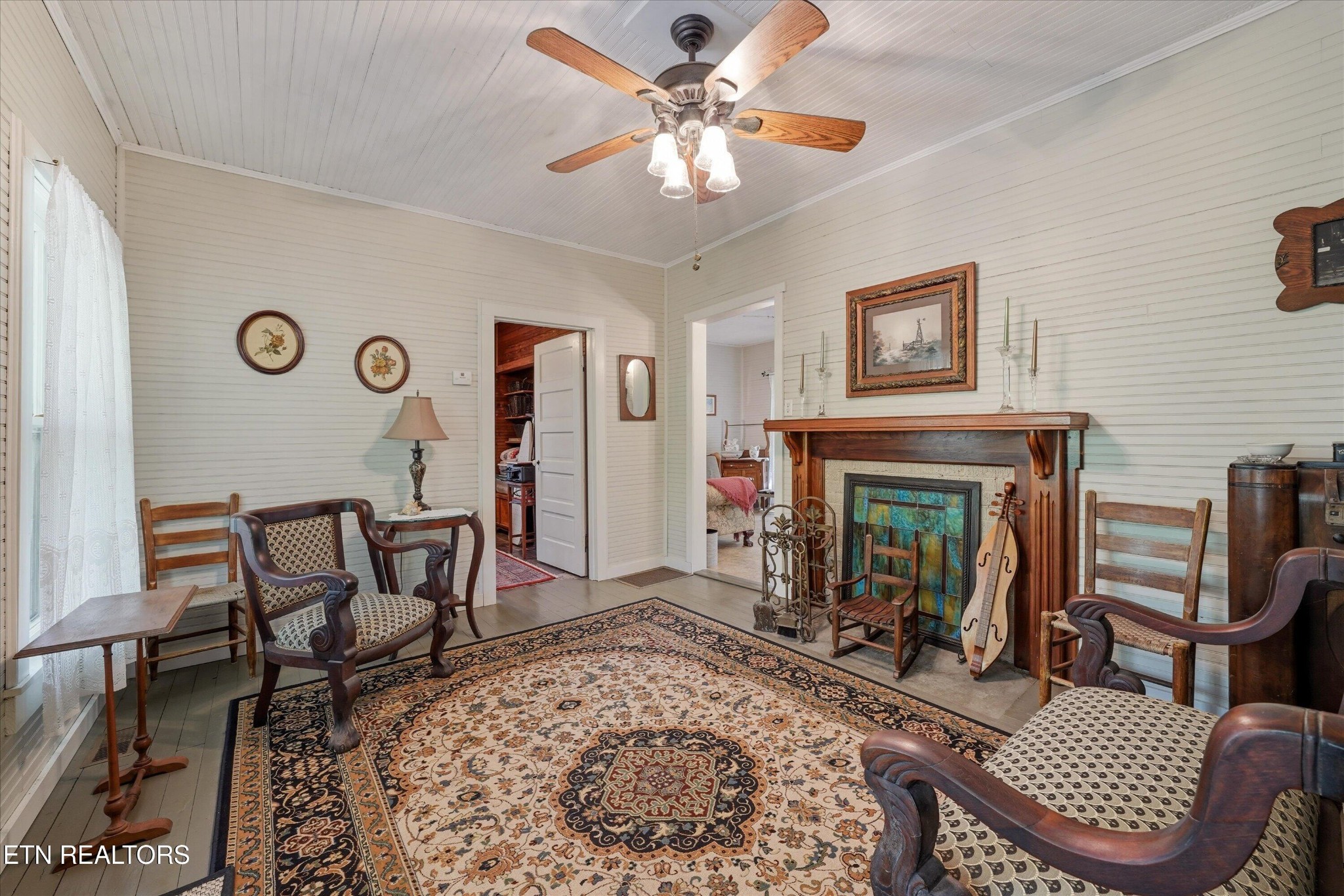 315 Laurel Hollow Road Clinton, TN 37716 - Photo 5 of 40 a living room with furniture and a fireplace
