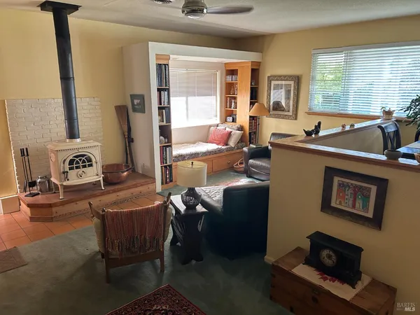 a spacious bedroom with two beds and a large window