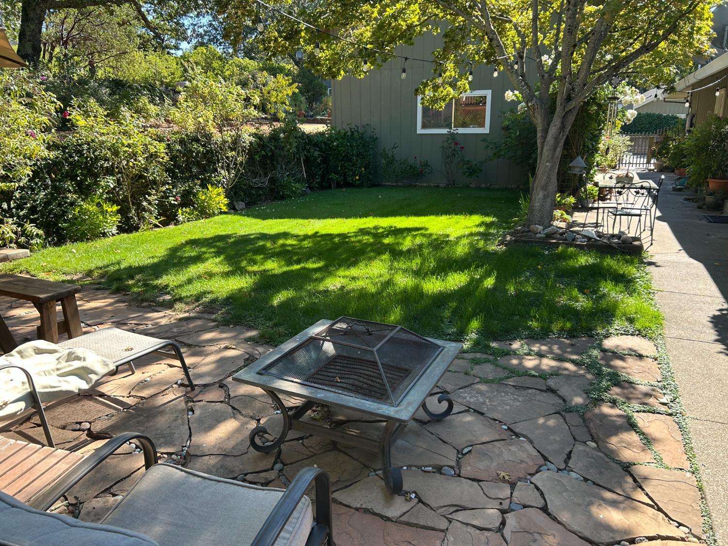271 White Cottage Road South Angwin, CA 94508 - Photo 7 of 30 a backyard of a house with yard and outdoor seating