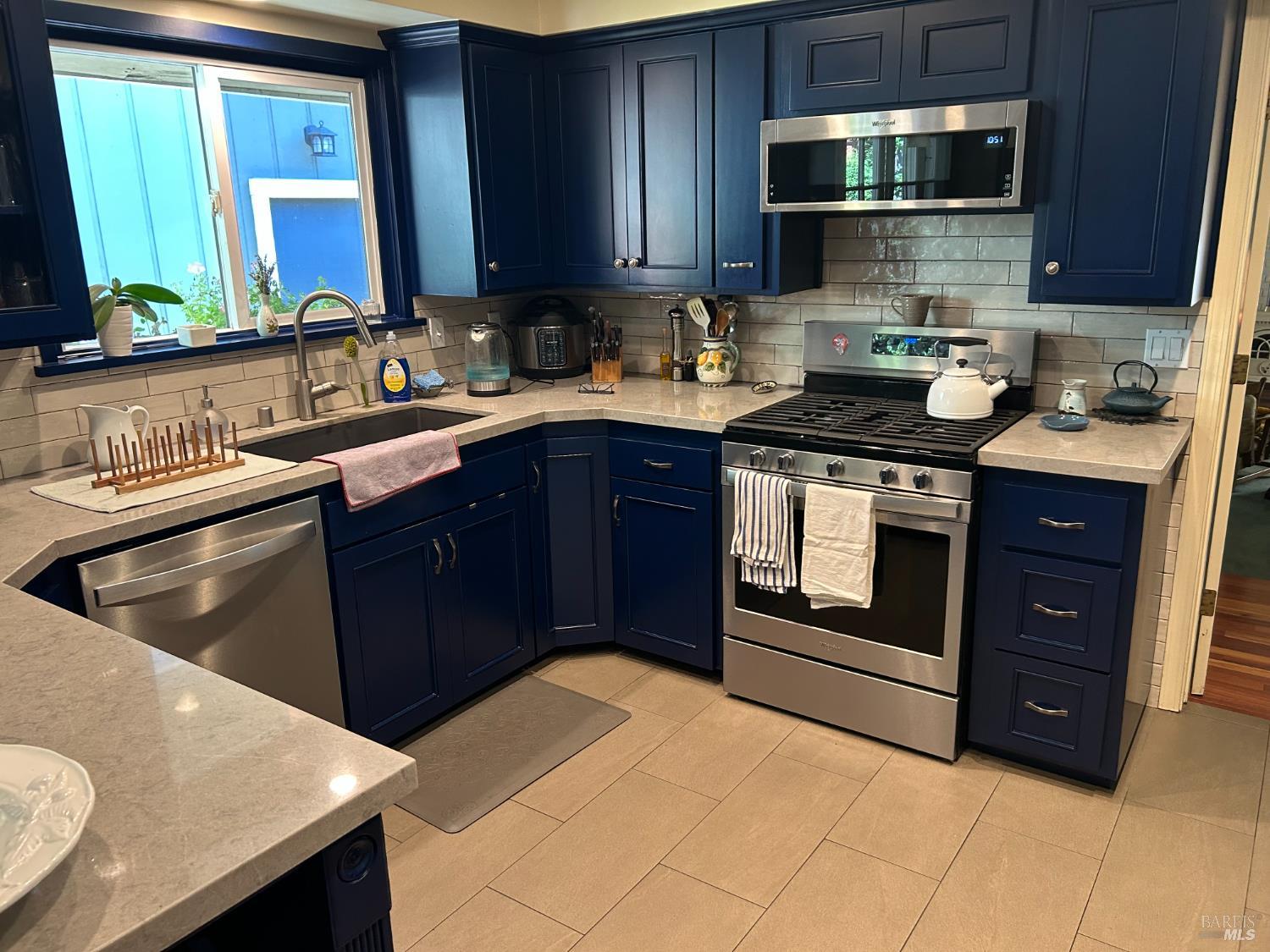 271 White Cottage Road South Angwin, CA 94508 - Photo 8 of 30 a kitchen with stainless steel appliances granite countertop a stove a sink and a microwave