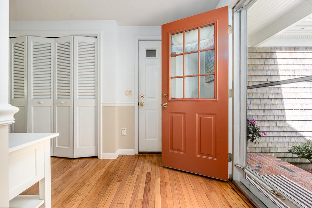 67 Spy Glass Hill Road Barnstable, MA 02675 - Photo 21 of 43 an empty room with wooden floor and windows