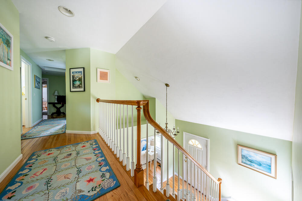 67 Spy Glass Hill Road Barnstable, MA 02675 - Photo 26 of 43 a view of a hallway with wooden floor and stairs