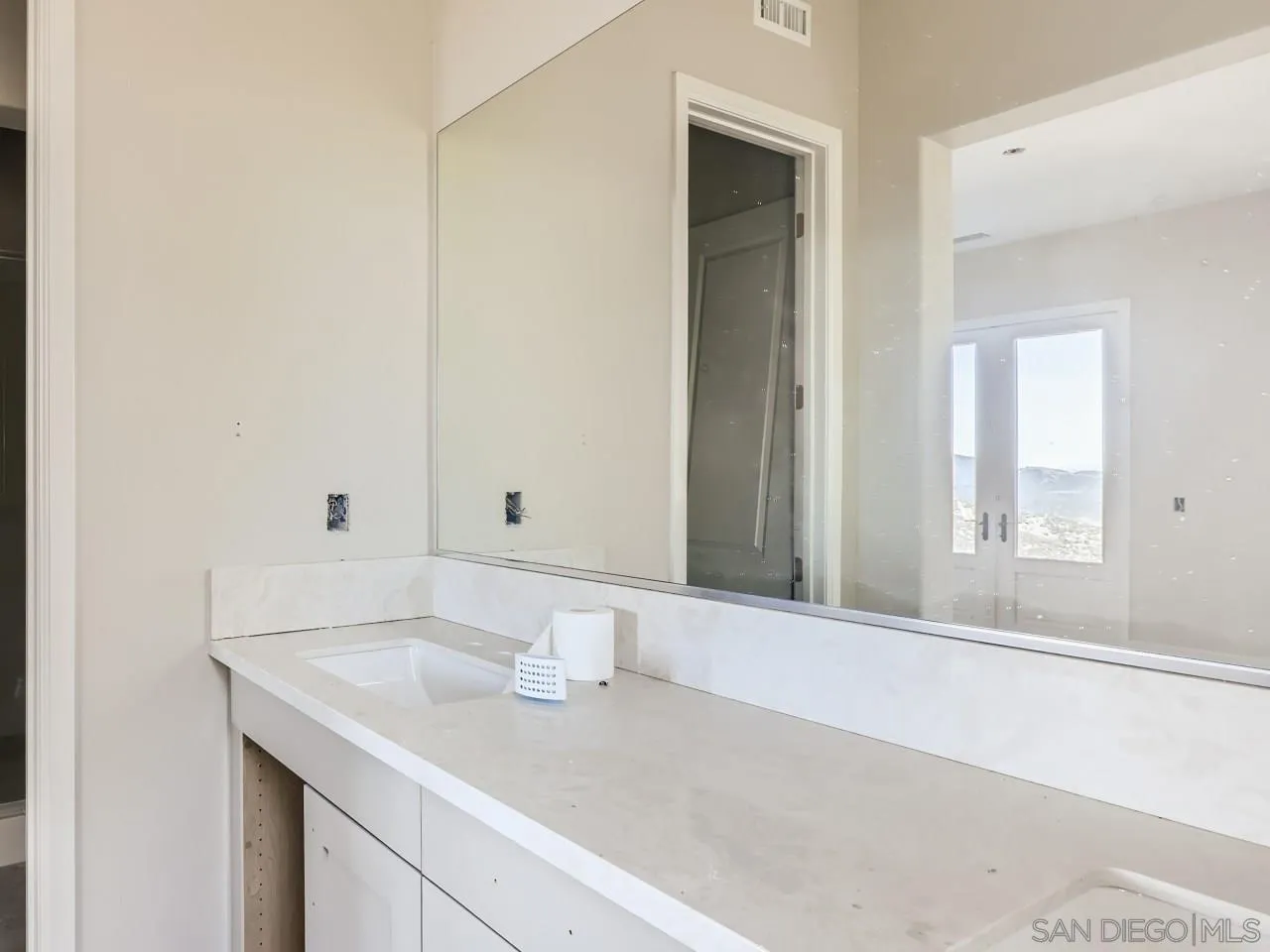 18214 Avenida Apice Escondido, CA 92029 - Photo 16 of 26 a bathroom with a sink and a mirror