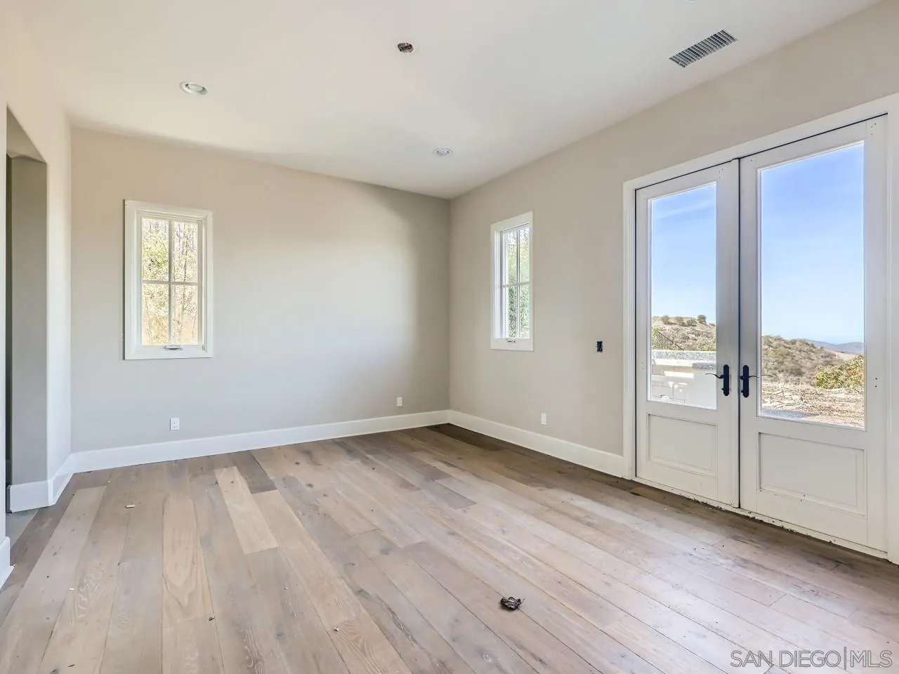 18214 Avenida Apice Escondido, CA 92029 - Photo 17 of 26 wooden floor in an empty room with a window