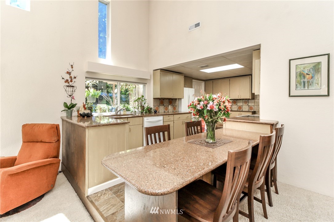 13005 Southeast 95th Way Renton, WA 98056 - Photo 8 of 40 a dining room with furniture and window