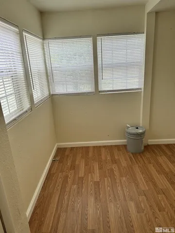 a bathroom with a toilet and a window