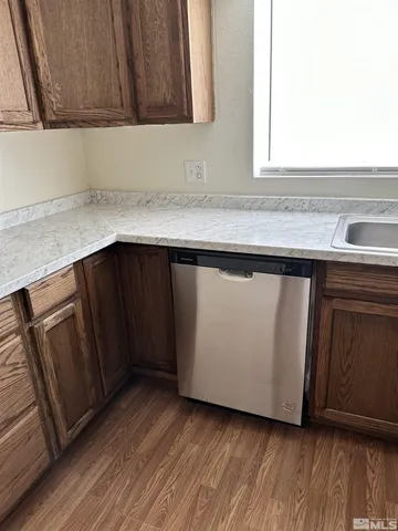 a close view of wooden cabinets and a sink