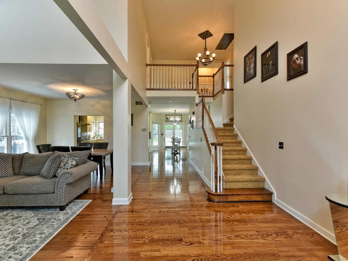117 Grey Fox Court Streamwood, IL 60107 - Photo 12 of 31 a living room with furniture and wooden floor