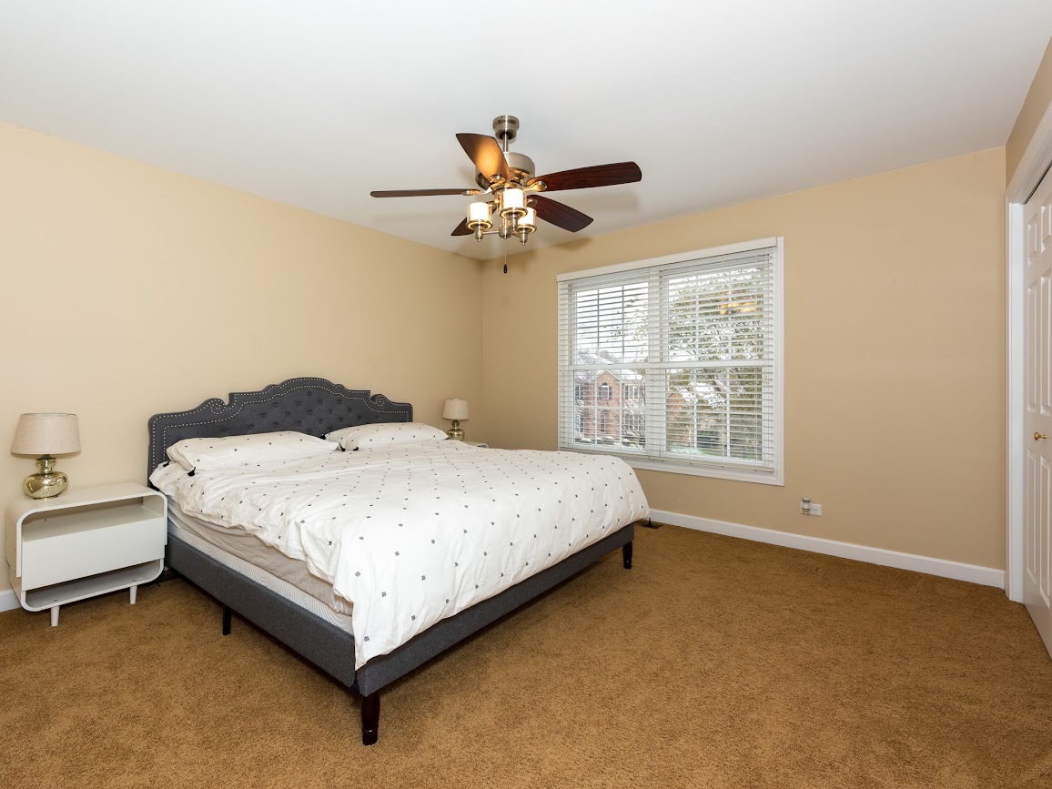 117 Grey Fox Court Streamwood, IL 60107 - Photo 20 of 31 a bedroom with a bed and a window