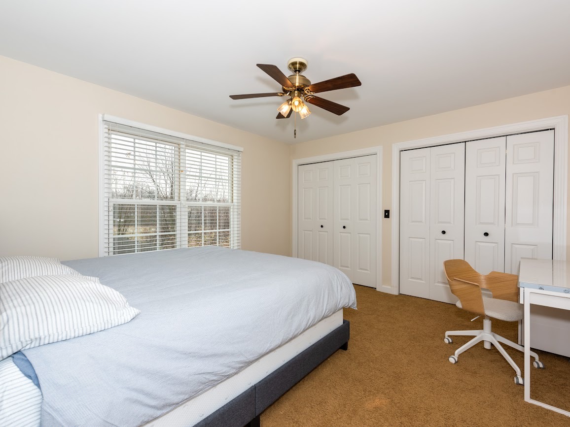 117 Grey Fox Court Streamwood, IL 60107 - Photo 21 of 31 a bedroom with a bed and a window