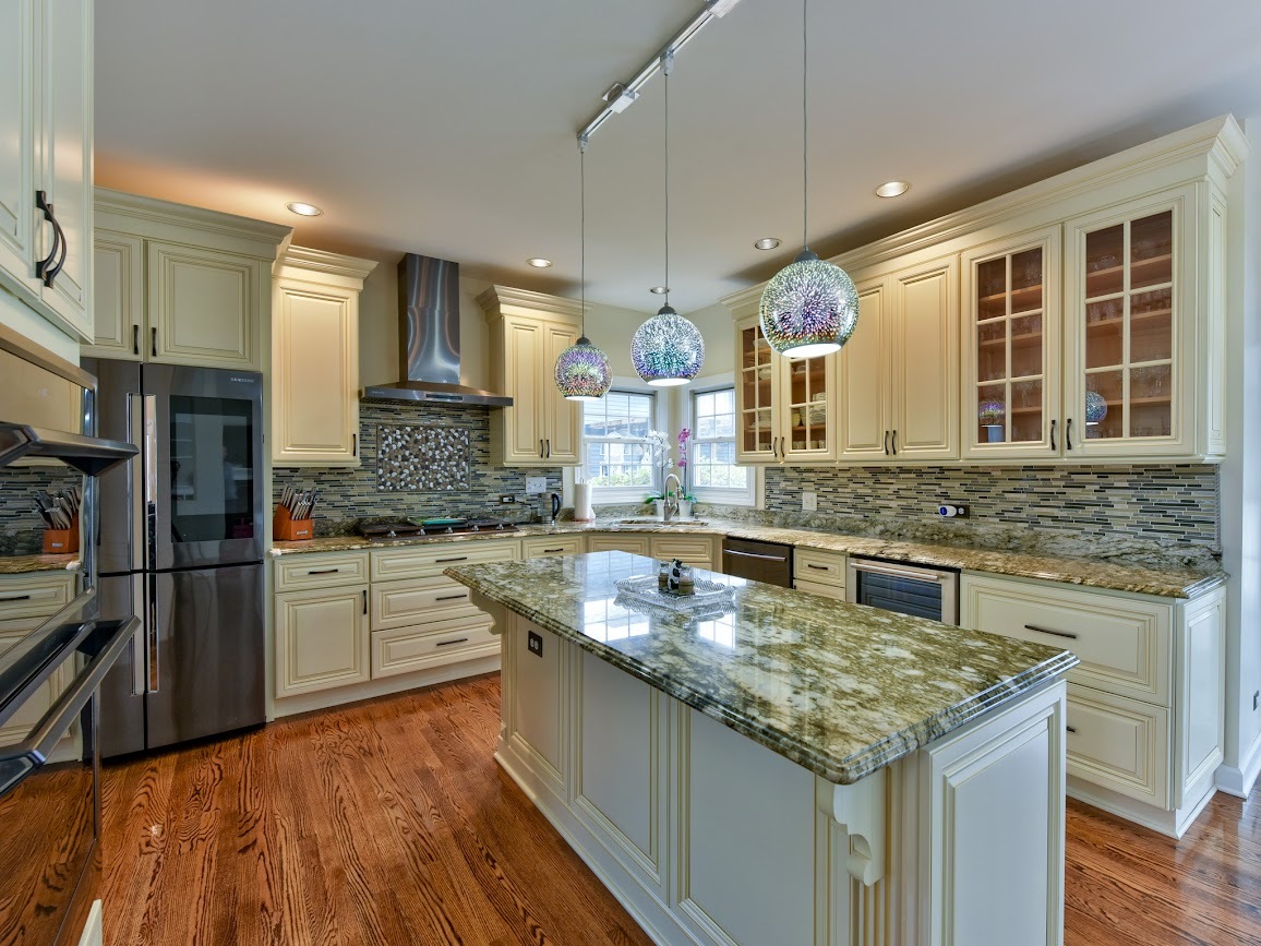 117 Grey Fox Court Streamwood, IL 60107 - Photo 8 of 31 a kitchen with stainless steel appliances granite countertop a sink stove and refrigerator