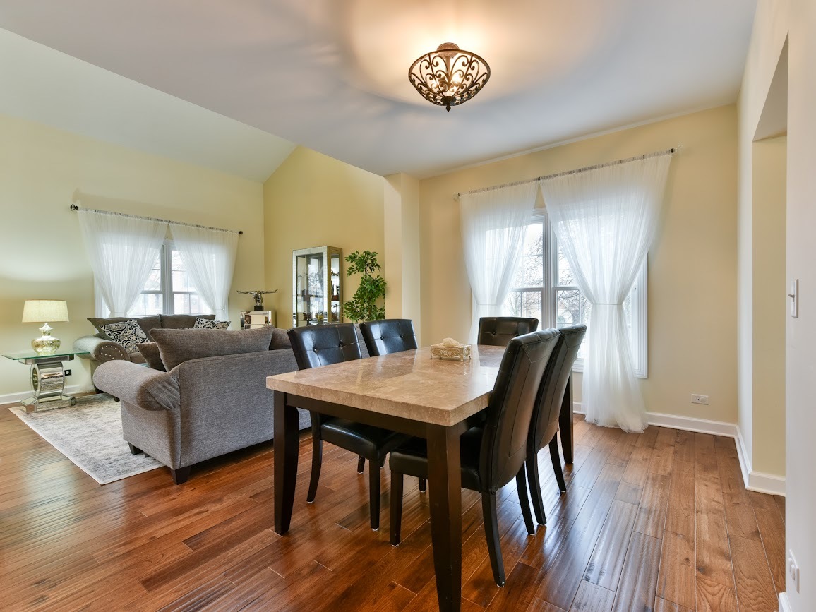117 Grey Fox Court Streamwood, IL 60107 - Photo 9 of 31 a view of a dining room with furniture and wooden floor