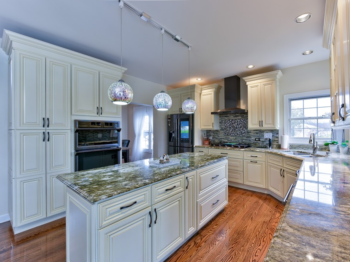 117 Grey Fox Court Streamwood, IL 60107 - Photo 10 of 31 a kitchen with kitchen island granite countertop wooden cabinets and a stove
