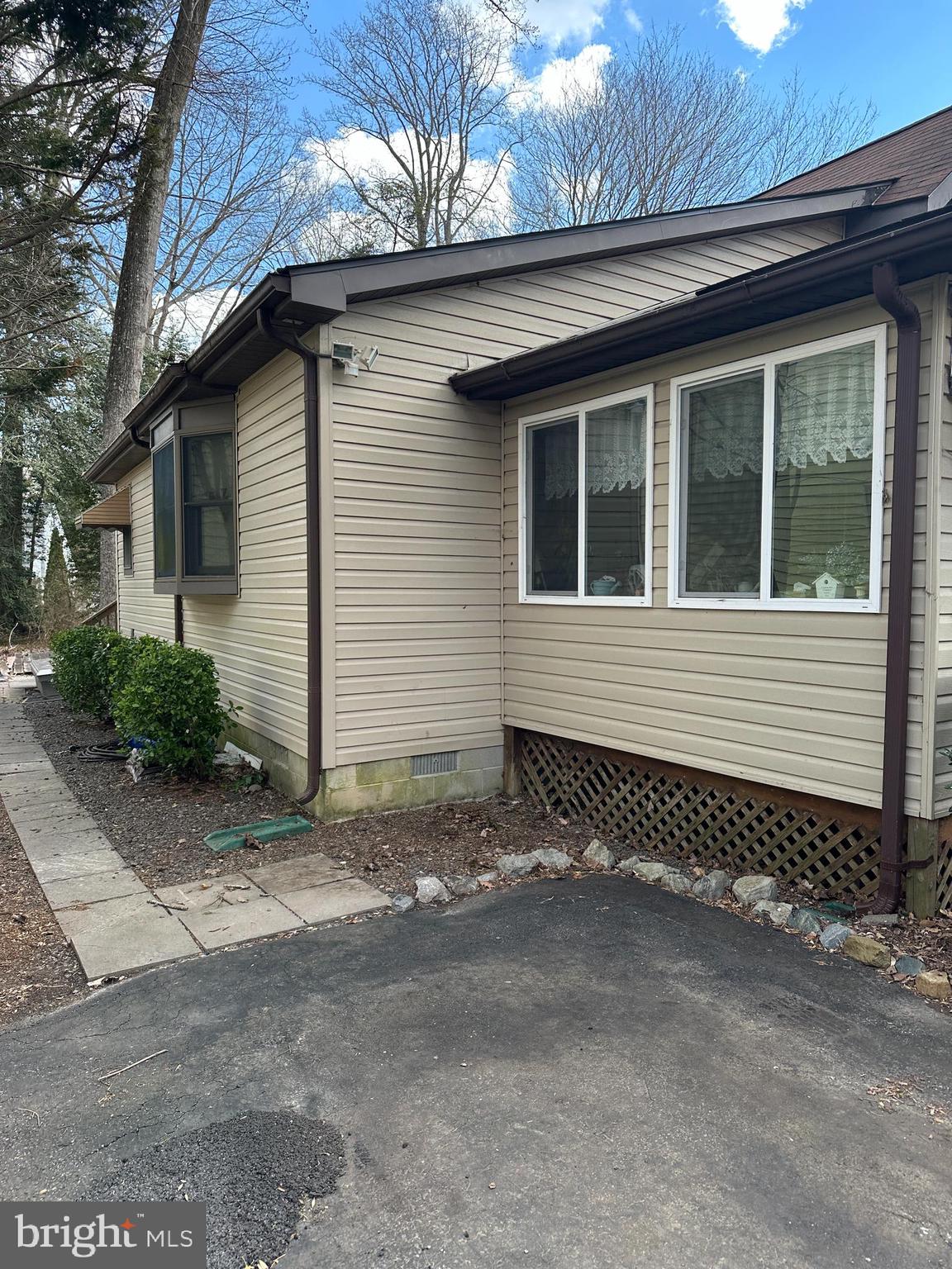 22887 Sycamore Drive Lewes, DE 19958 - Photo 11 of 38 a small house with a window