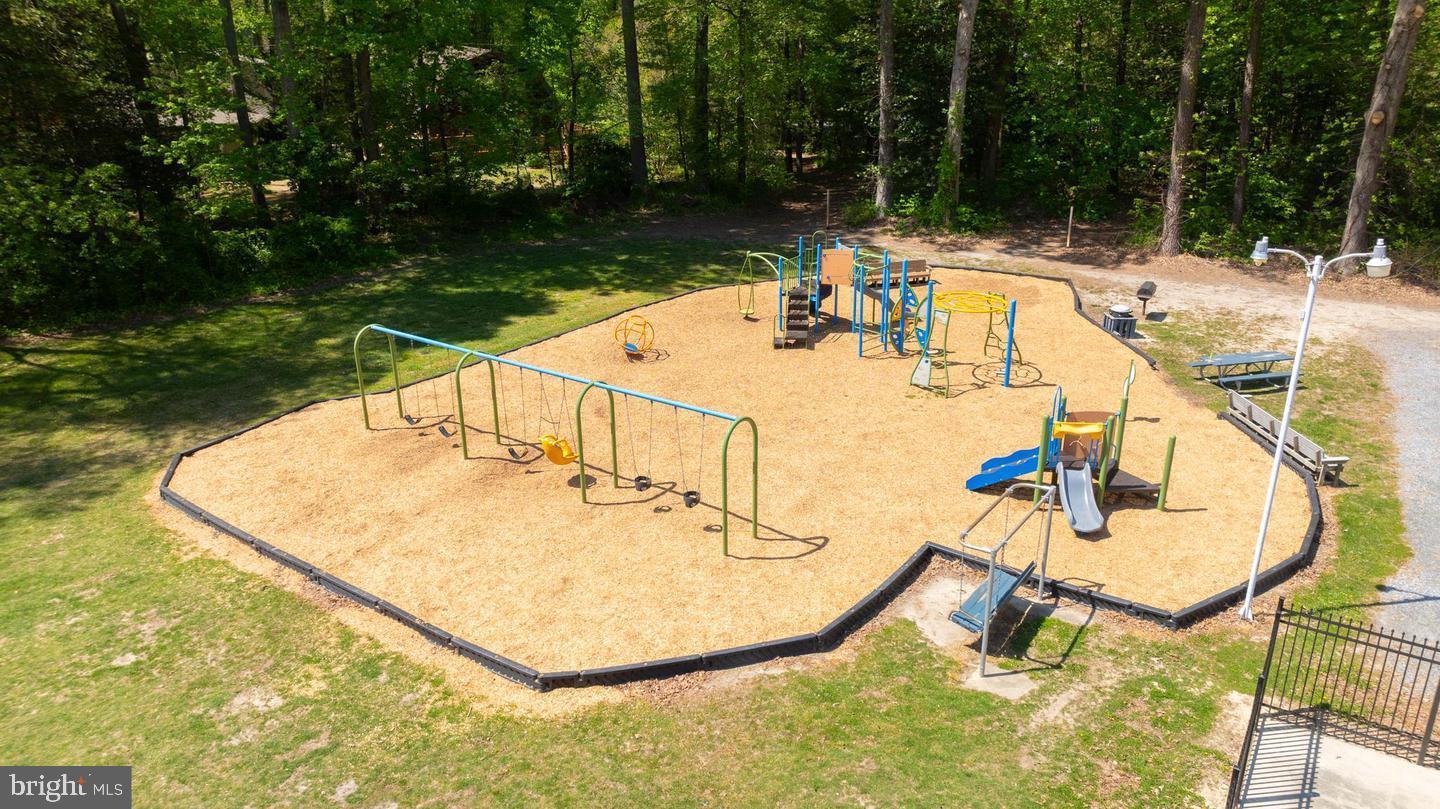 22887 Sycamore Drive Lewes, DE 19958 - Photo 14 of 38 a view of a swimming pool with a patio