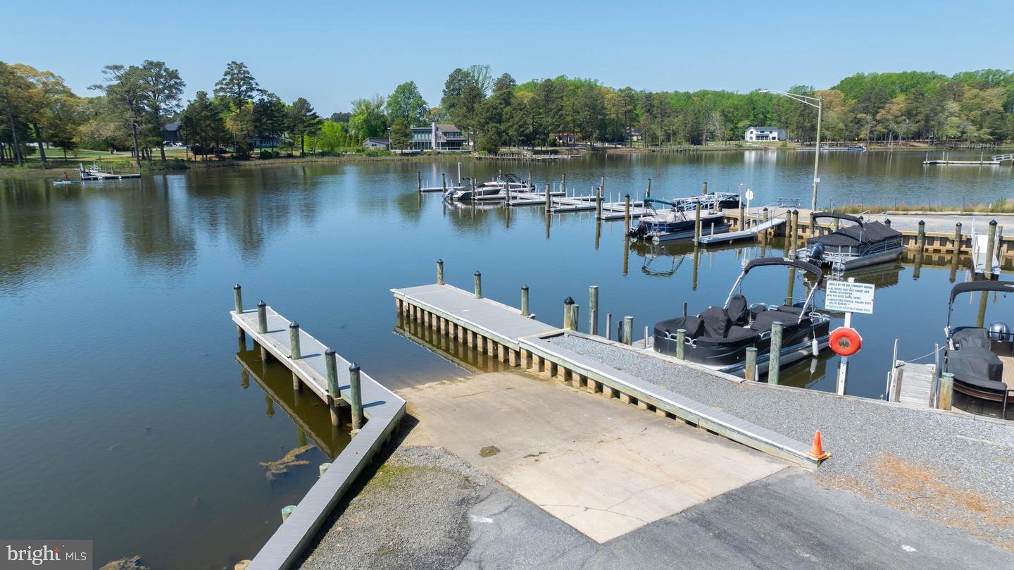 22887 Sycamore Drive Lewes, DE 19958 - Photo 20 of 38 a view of a lake with sitting area and lake view