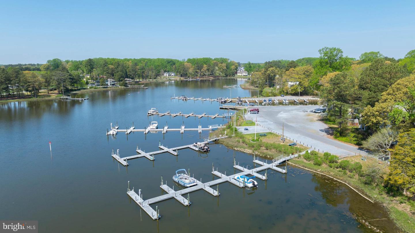 22887 Sycamore Drive Lewes, DE 19958 - Photo 21 of 38 an aerial view of a residential houses with outdoor space and lake view