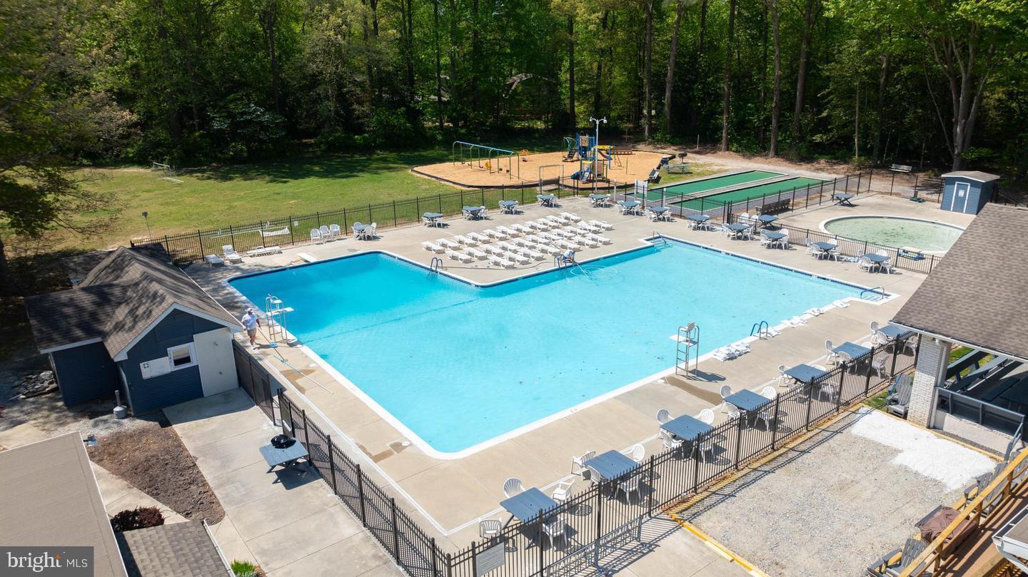 22887 Sycamore Drive Lewes, DE 19958 - Photo 22 of 38 a view of a swimming pool with a patio