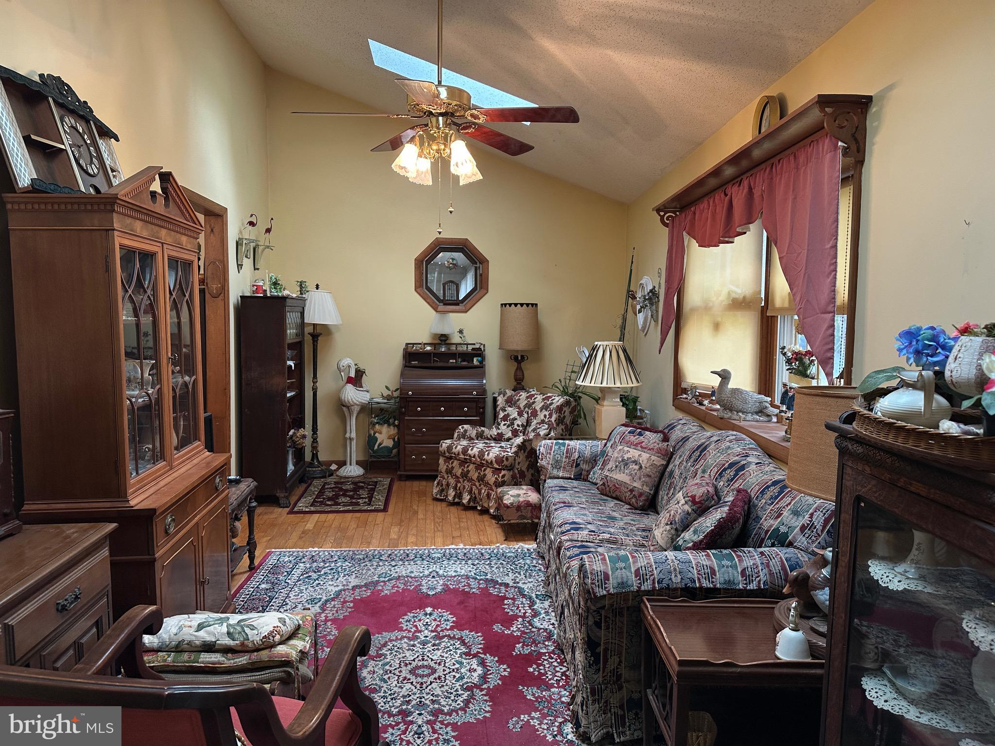 22887 Sycamore Drive Lewes, DE 19958 - Photo 28 of 38 a living room with fireplace furniture and a window