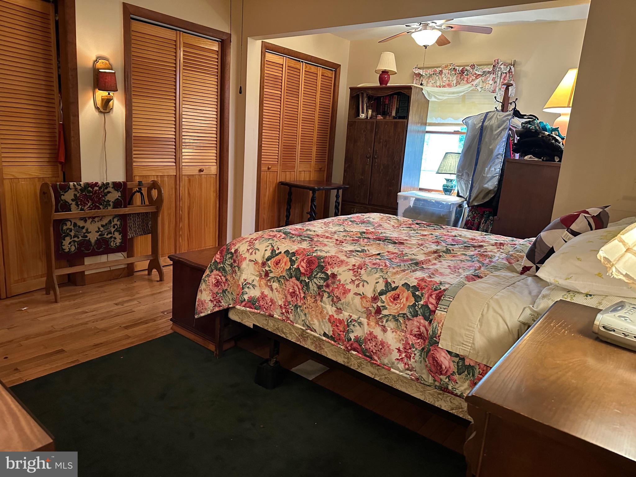 22887 Sycamore Drive Lewes, DE 19958 - Photo 36 of 38 a bed sitting in a bedroom next to a window with pc on the wall