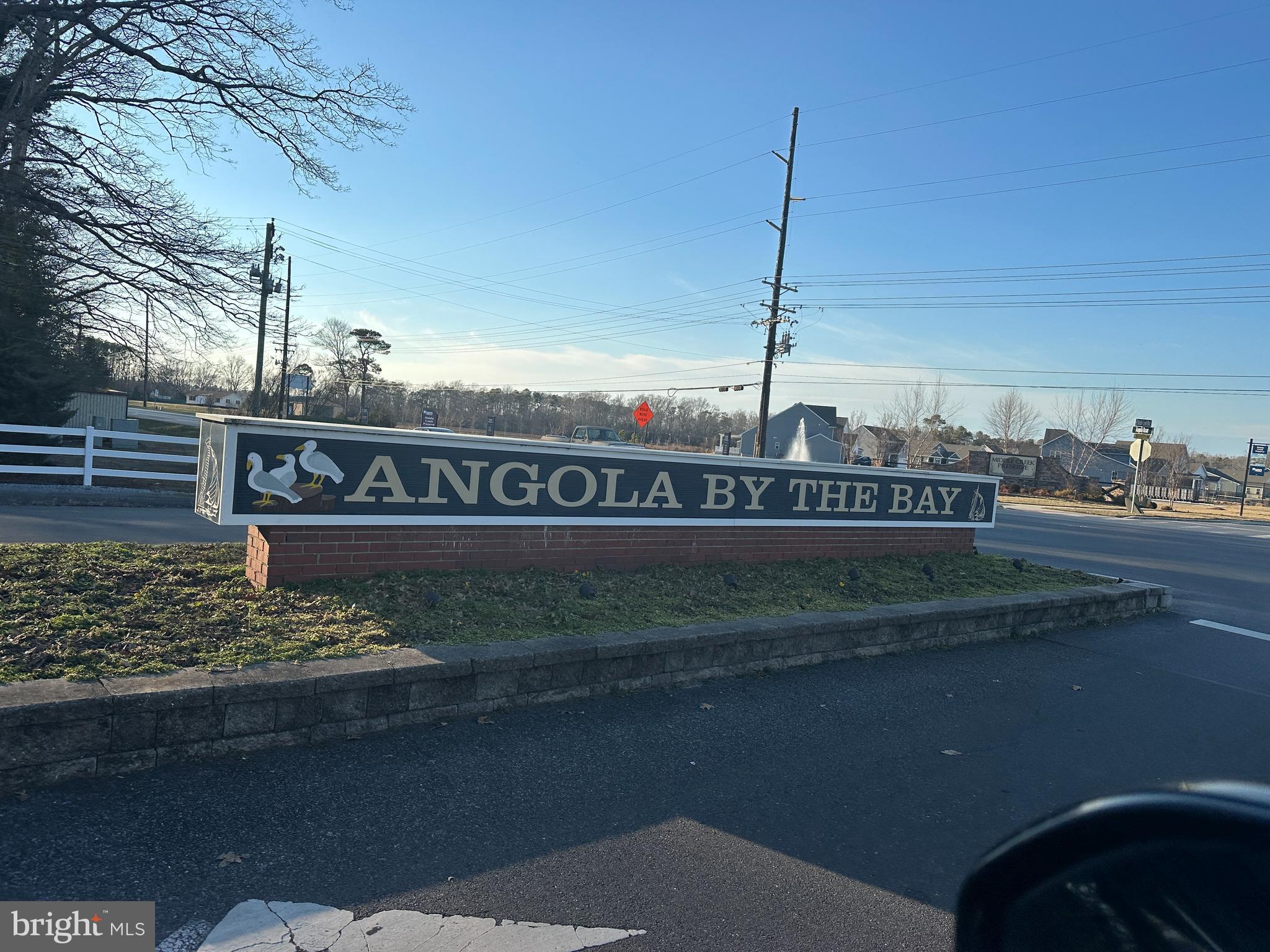 22887 Sycamore Drive Lewes, DE 19958 - Photo 4 of 38 a view of a street with a park on both side of it