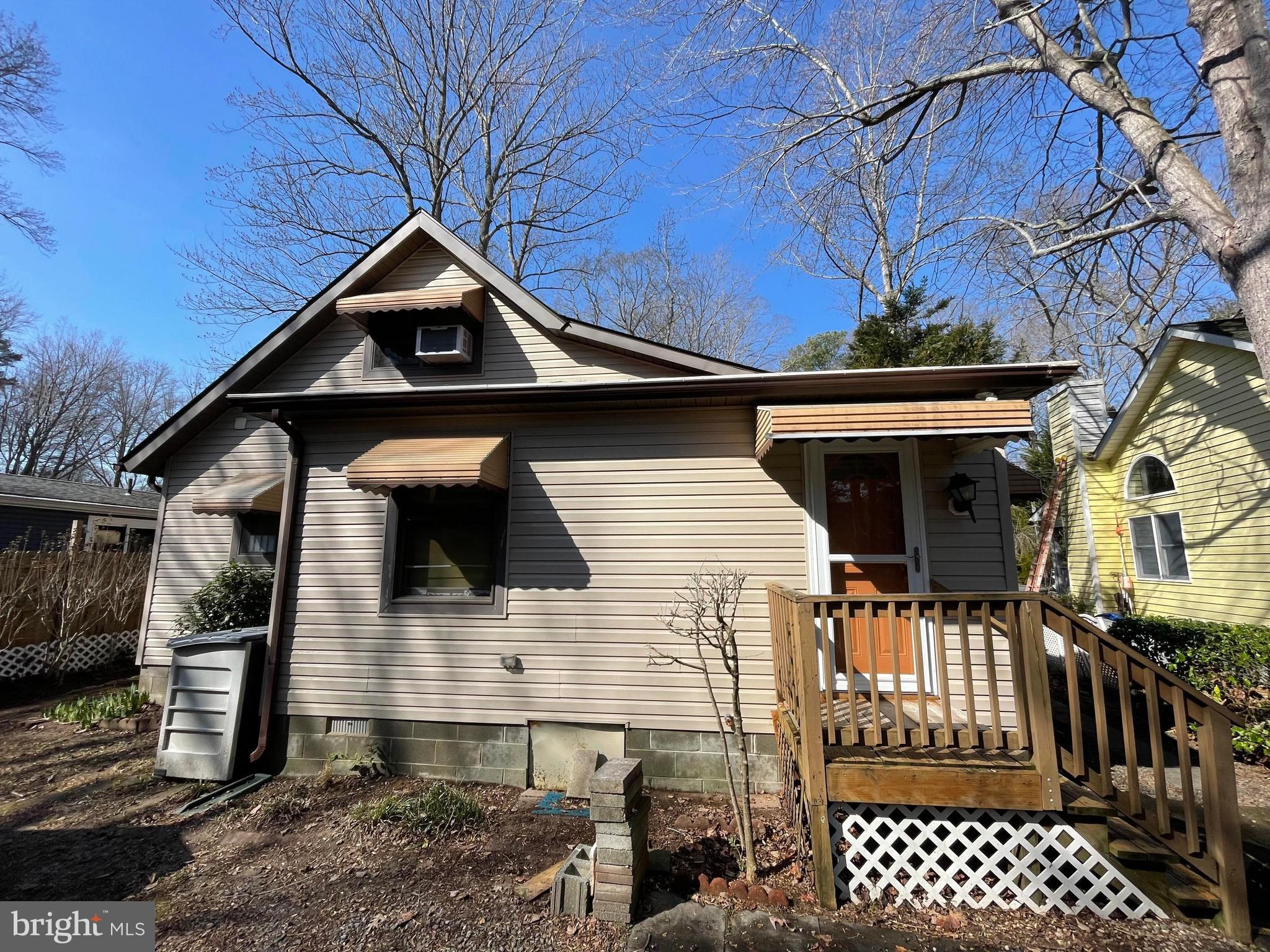 22887 Sycamore Drive Lewes, DE 19958 - Photo 5 of 38 a front view of a house with a yard