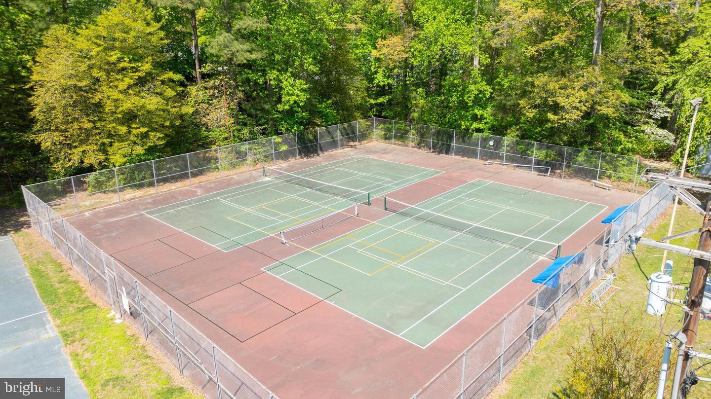 22887 Sycamore Drive Lewes, DE 19958 - Photo 10 of 38 a view of an outdoor space and tennis court