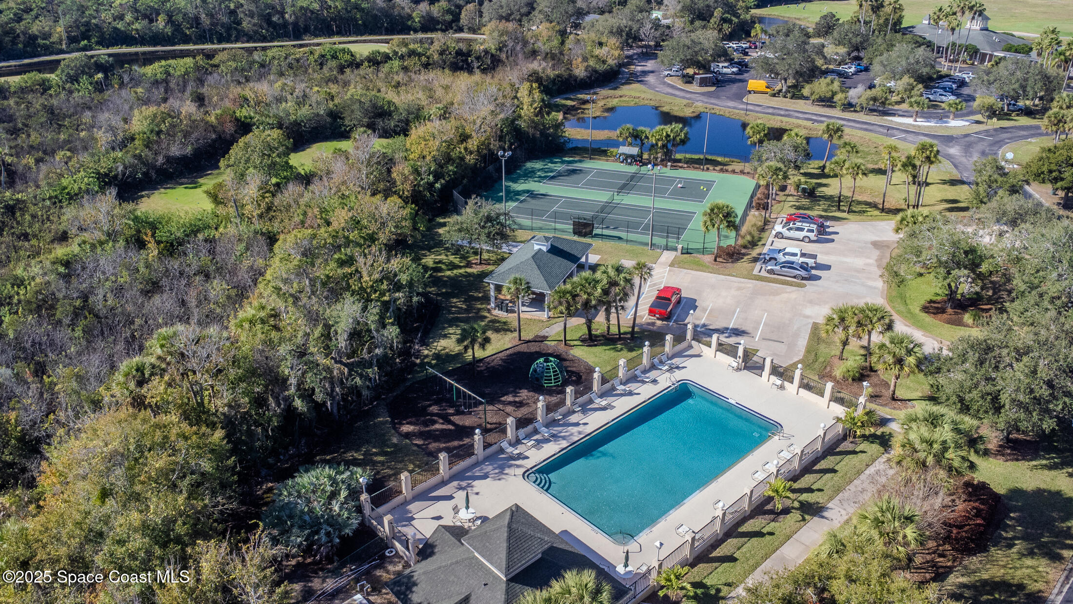 8201 Compton Way Melbourne, FL 32940 - Photo 50 of 52 an aerial view of a house with a garden and lake view