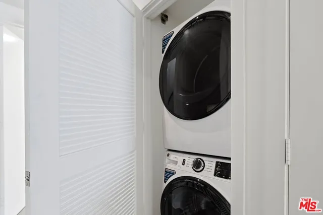 a close up view of a washer and dryer in a utility room