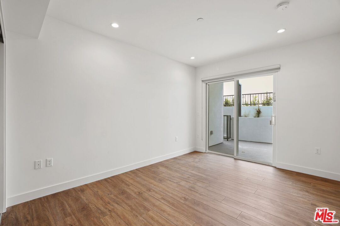 130 South Croft Avenue, Unit 201 Los Angeles, CA 90048 - Photo 10 of 14 wooden floor in an empty room with a window