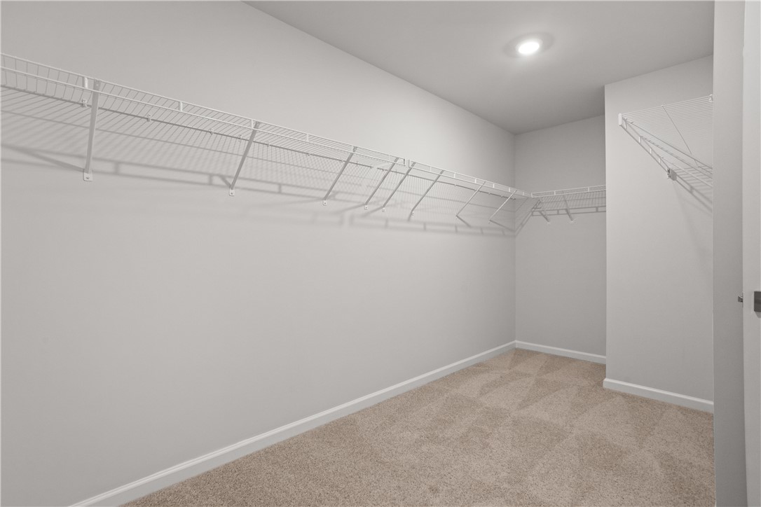 629 Sweetspire Trail, Unit 149 Seneca, SC 29678 - Photo 26 of 30 A well-organized walk-in closet with ample wire shelving provides generous storage space.