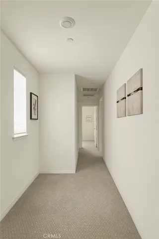 a view of an empty room and a window