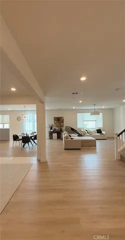 a room with lots of furniture and view kitchen