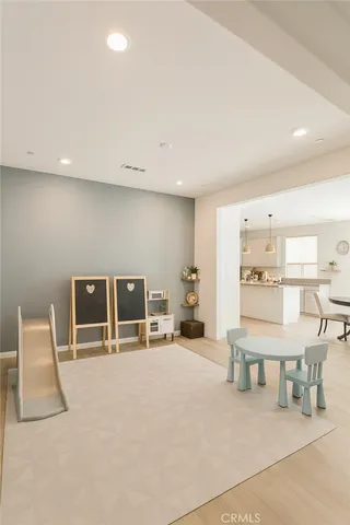 a living room with furniture a table and chairs