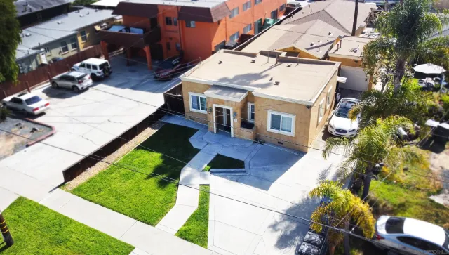 an aerial view of a house with a swimming pool