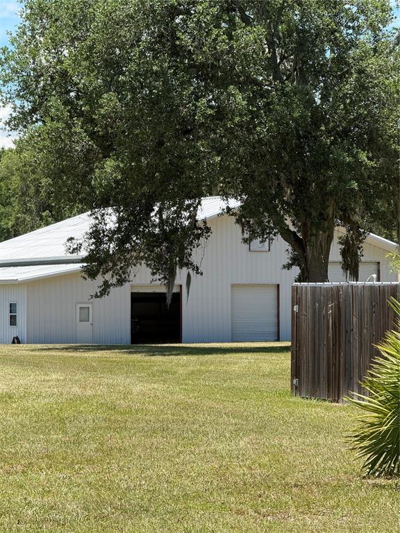 7390 South Mc Alpin Road McAlpin, FL 32062 - Photo 36 of 53 a view of a house with a yard