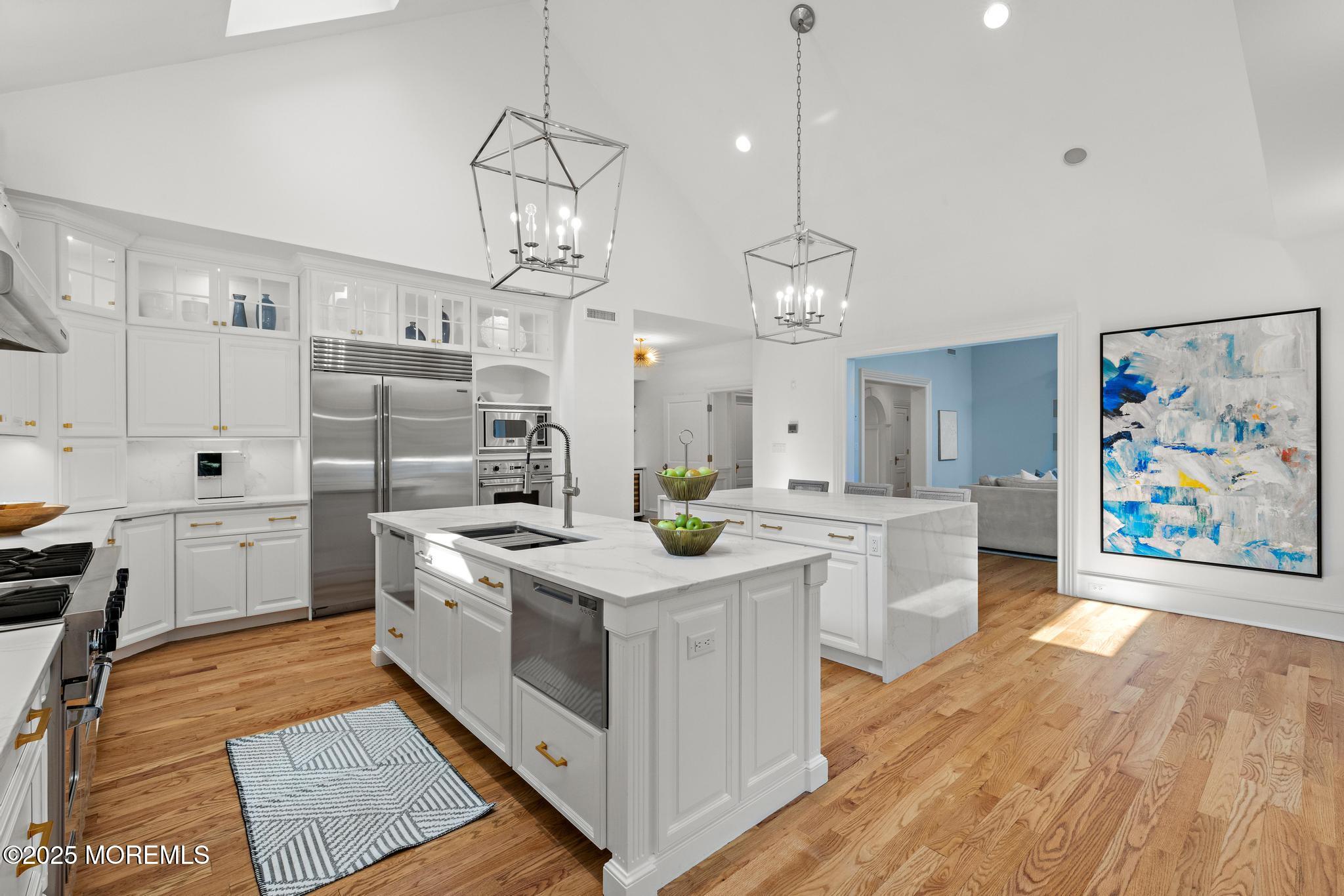 129 Ave Of Two Rivers Rumson, NJ 07760 - Photo 11 of 55 a kitchen that has a lot of cabinets in it