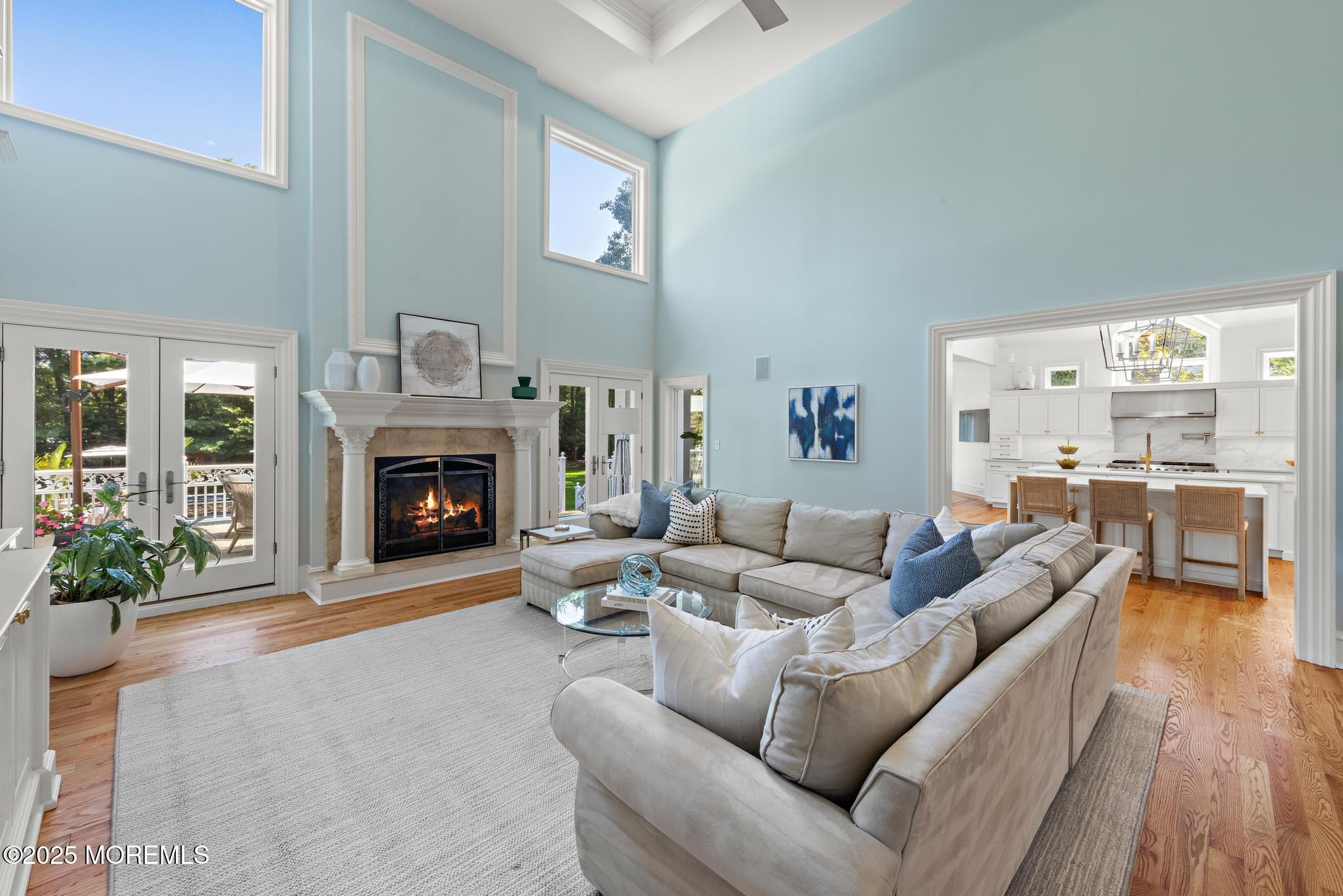 129 Ave Of Two Rivers Rumson, NJ 07760 - Photo 13 of 55 a living room with furniture and a fireplace