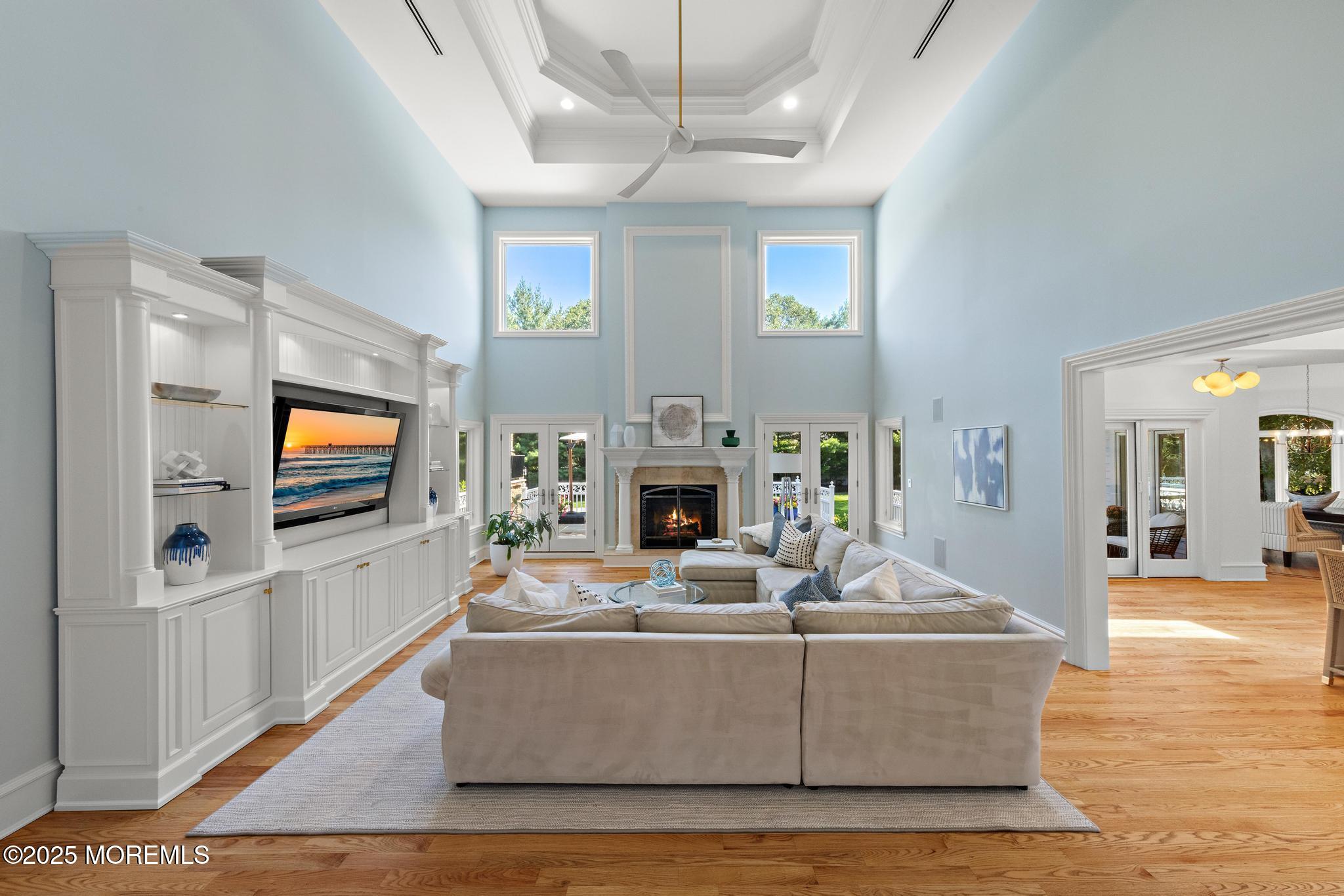 129 Ave Of Two Rivers Rumson, NJ 07760 - Photo 14 of 55 a living room with fireplace furniture and a flat screen tv