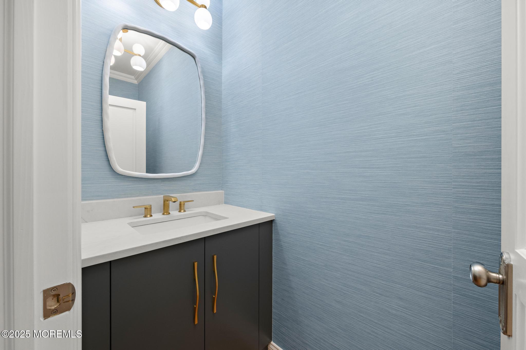 129 Ave Of Two Rivers Rumson, NJ 07760 - Photo 18 of 55 a bathroom with a sink and a mirror