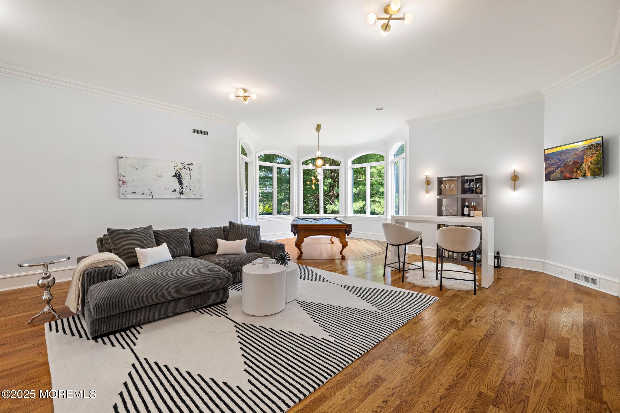 129 Ave Of Two Rivers Rumson, NJ 07760 - Photo 19 of 55 a living room with furniture and wooden floor