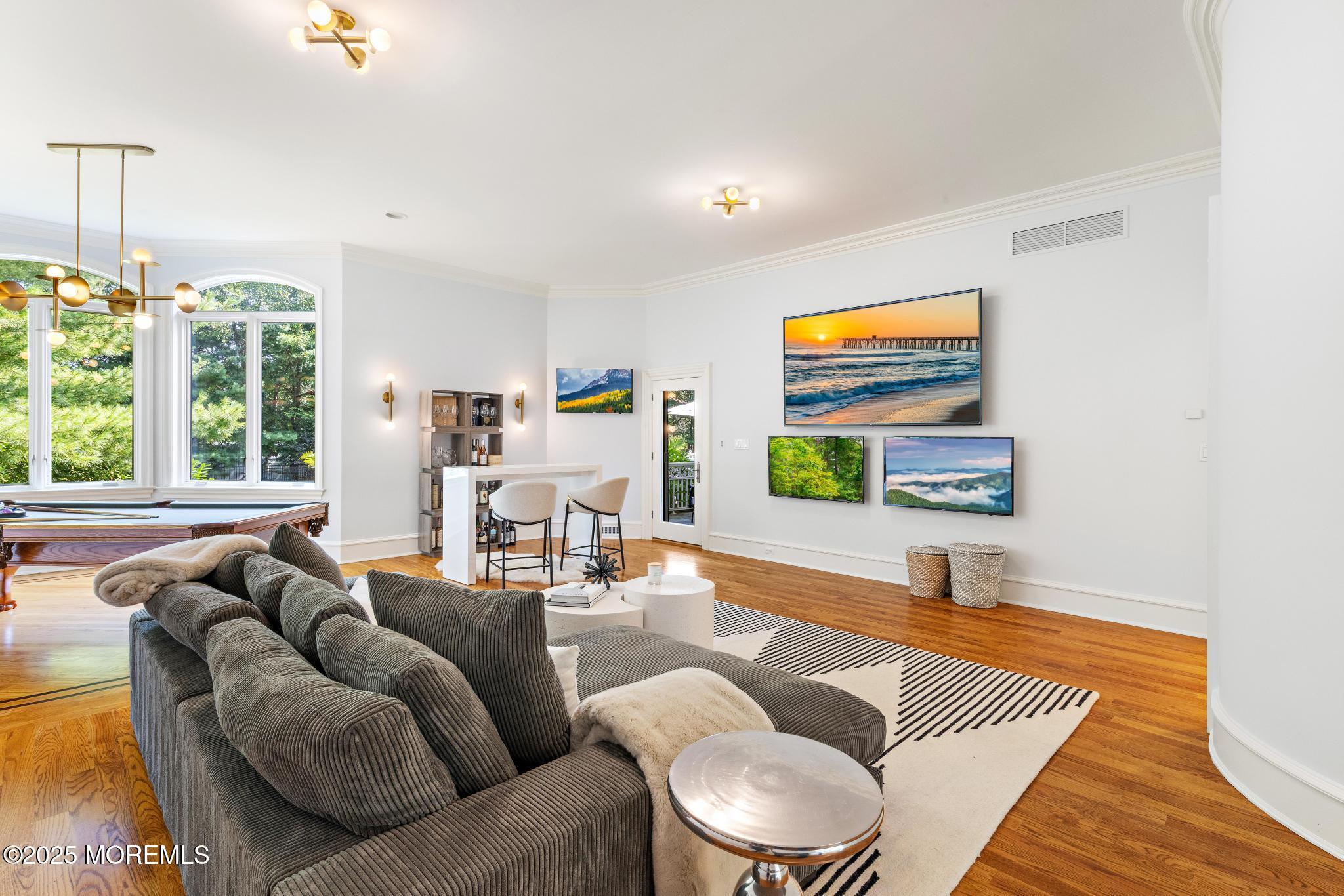 129 Ave Of Two Rivers Rumson, NJ 07760 - Photo 20 of 55 a living room with furniture and a flat screen tv